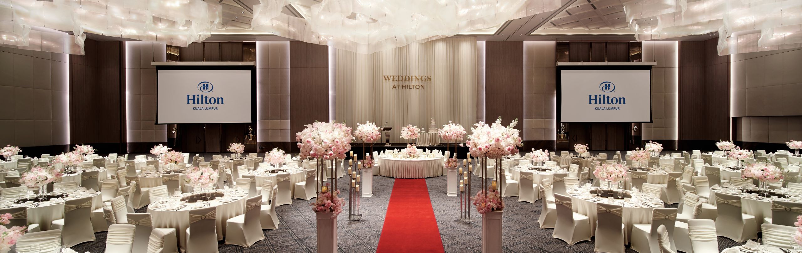 A wide-angle shot of the Grand Ballroom with a wedding set-up.